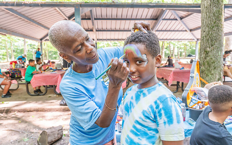 A child having his face painted