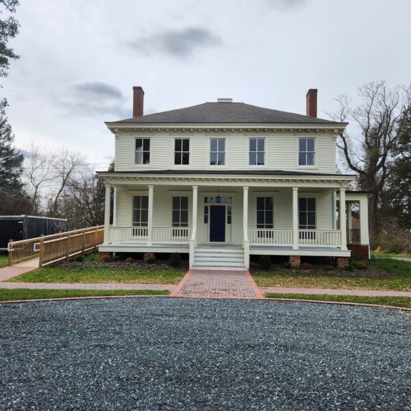 Picture of Chelsea Historic mansion. it is a white mansion with 8 windows on the front