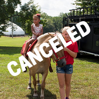 A girl riding a pony being led by another girl. Bold text reading "Canceled" is over the image