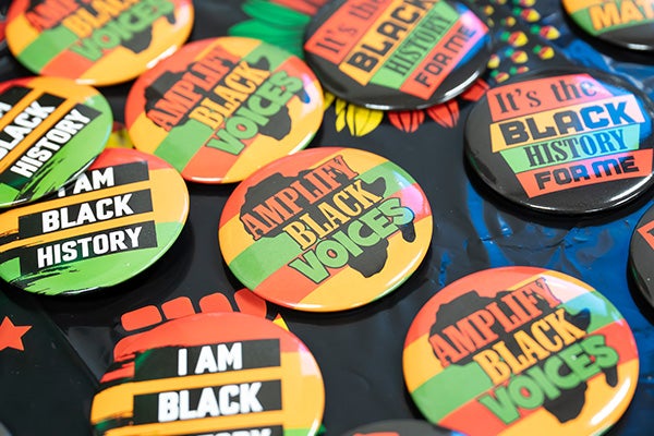 Closeup of various pin-on buttons that read 