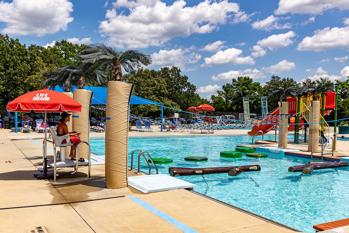 An outdoor splash park with climbing elements, waterslides, and more.